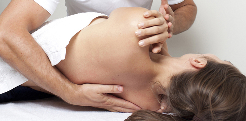 Woman receiving chiropractic treatment