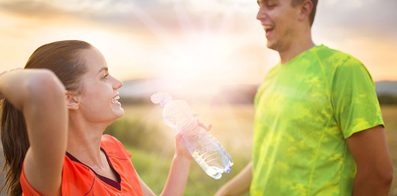 Two people wearing active wear talking