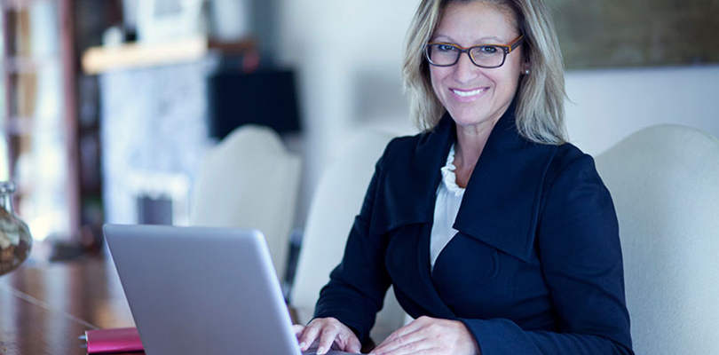 Woman is working at her computer finishing a major project