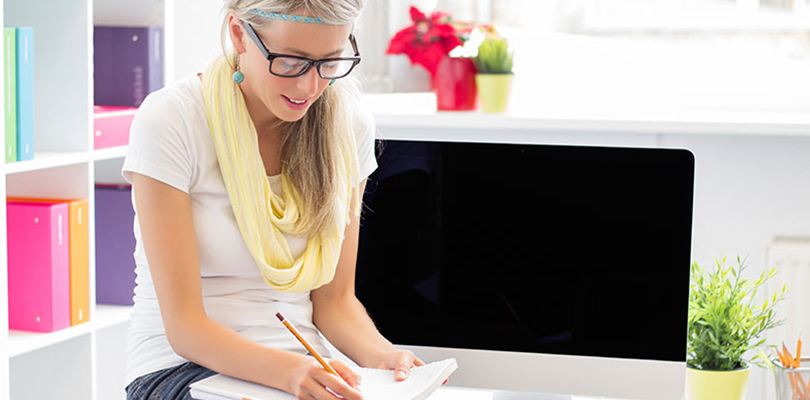 Woman is working away on your notepad