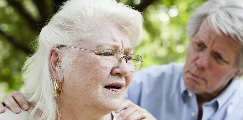 A senior woman experiencing shortness of breath