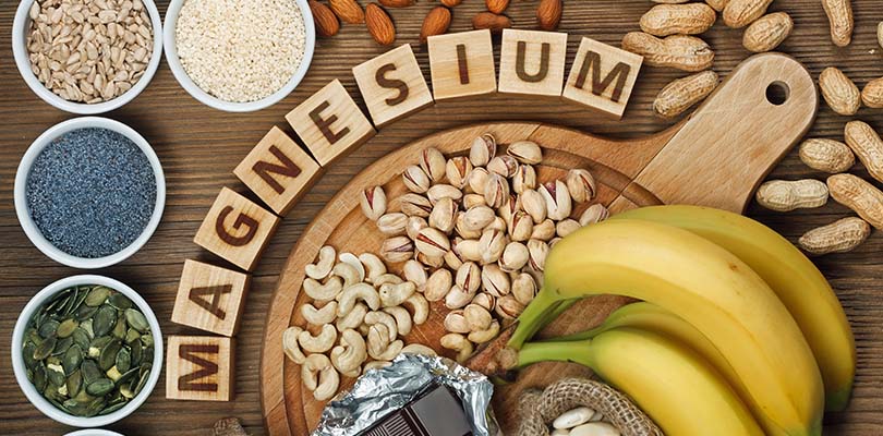 A variety of magnesium-rich foods lay on a table
