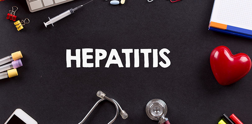 The word "hepatitis" is written on a chalkboard