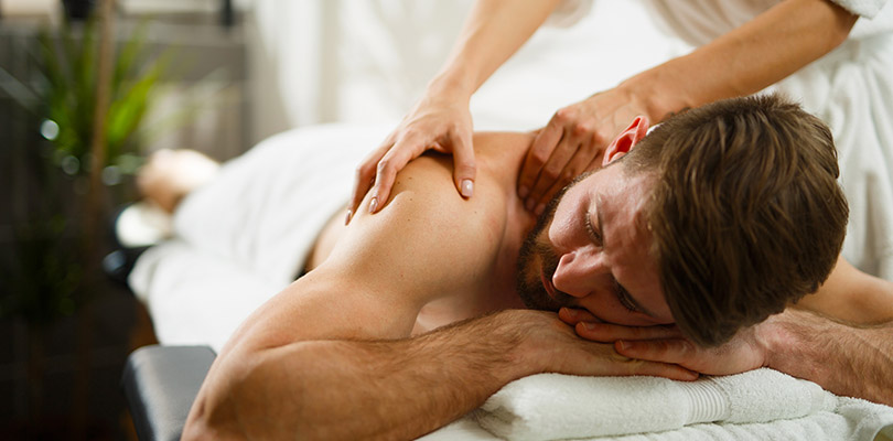 A man is receiving massage therapy