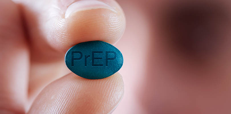 Young man with a PrEP pill
